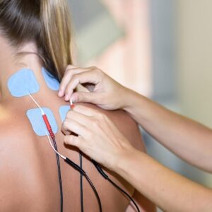 electro stimulation physical therapy young woman