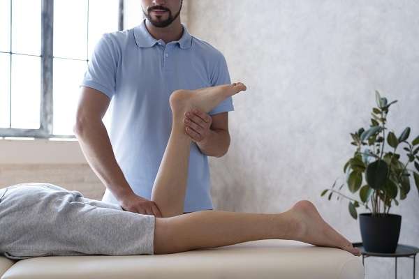 physiotherapist helping patient close up