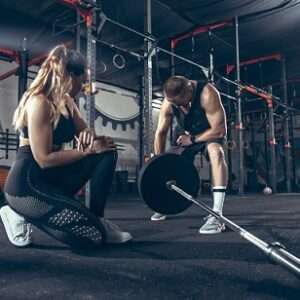 athletic man woman with dumbbells