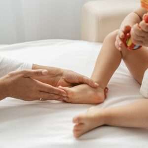 osteopathist treating baby girl s feet