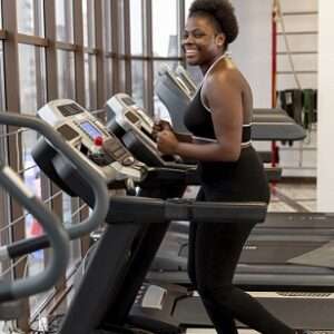 side view young woman treadmill