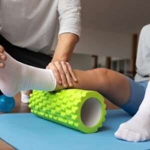 patient doing physical rehabilitation helped by therapists 1 1