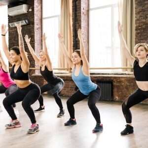 portrait adult women working out together