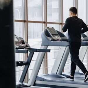 stylish guy gym is training treadmill healthy lifestyle